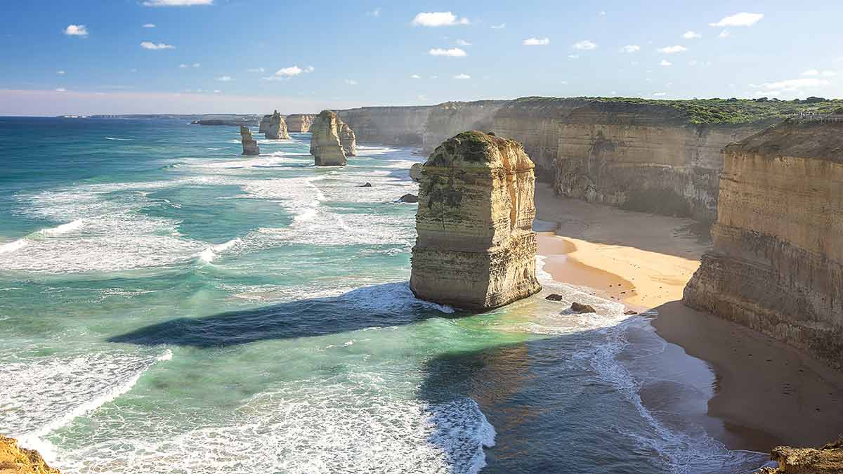 Twelve Apostles on Great Ocean Road with emerald ocean and tall cliffs