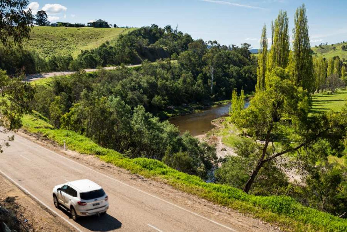 white car driving along the Great Alpine Road
