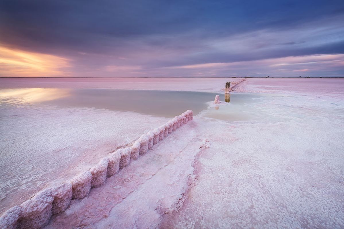 two women walking past the Mildura Sunraysia mural