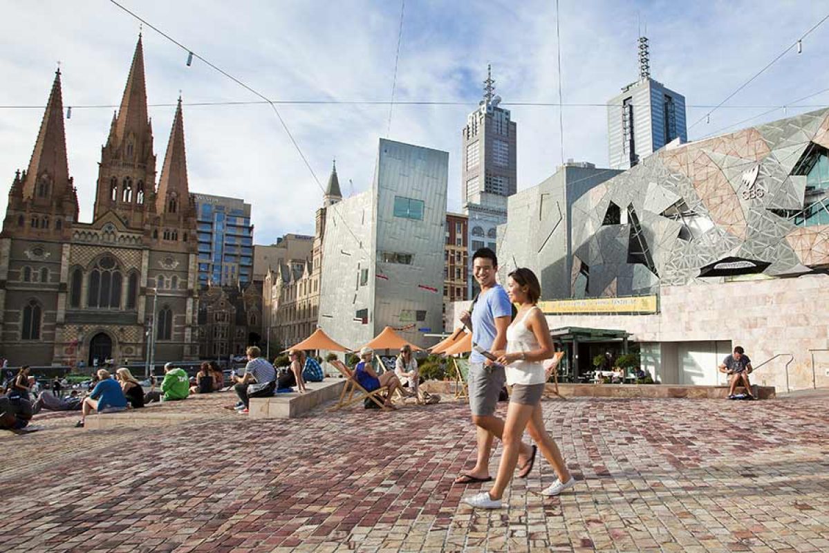 people walking in Melbourne's Federation Square in the daytime
