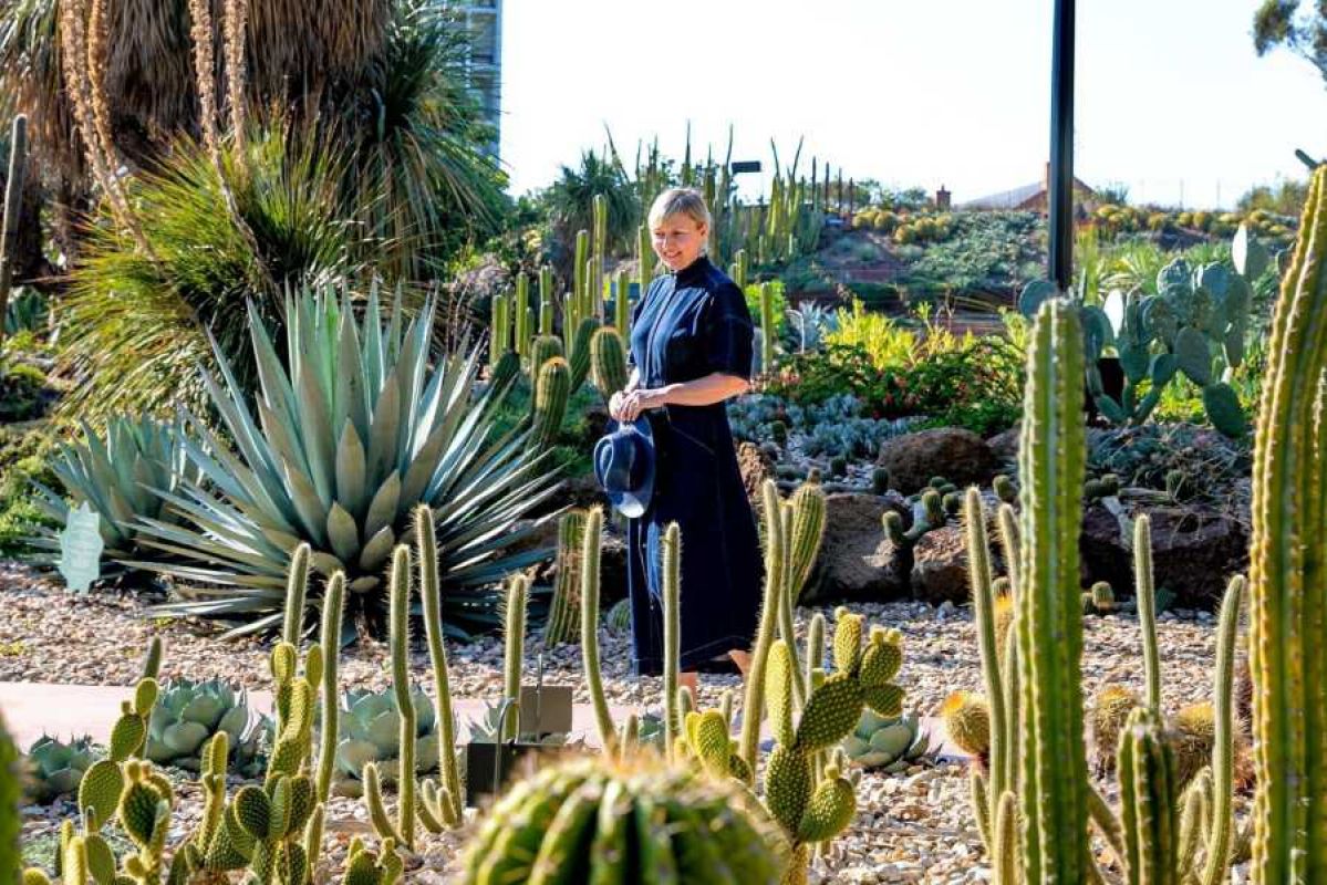 A woman walking through a cactus display at the free-to-enter Royal Botanic Gardens Melbourne