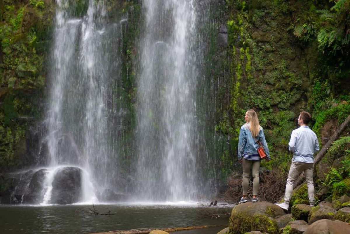 Two people enjoying Beauchamp Falls