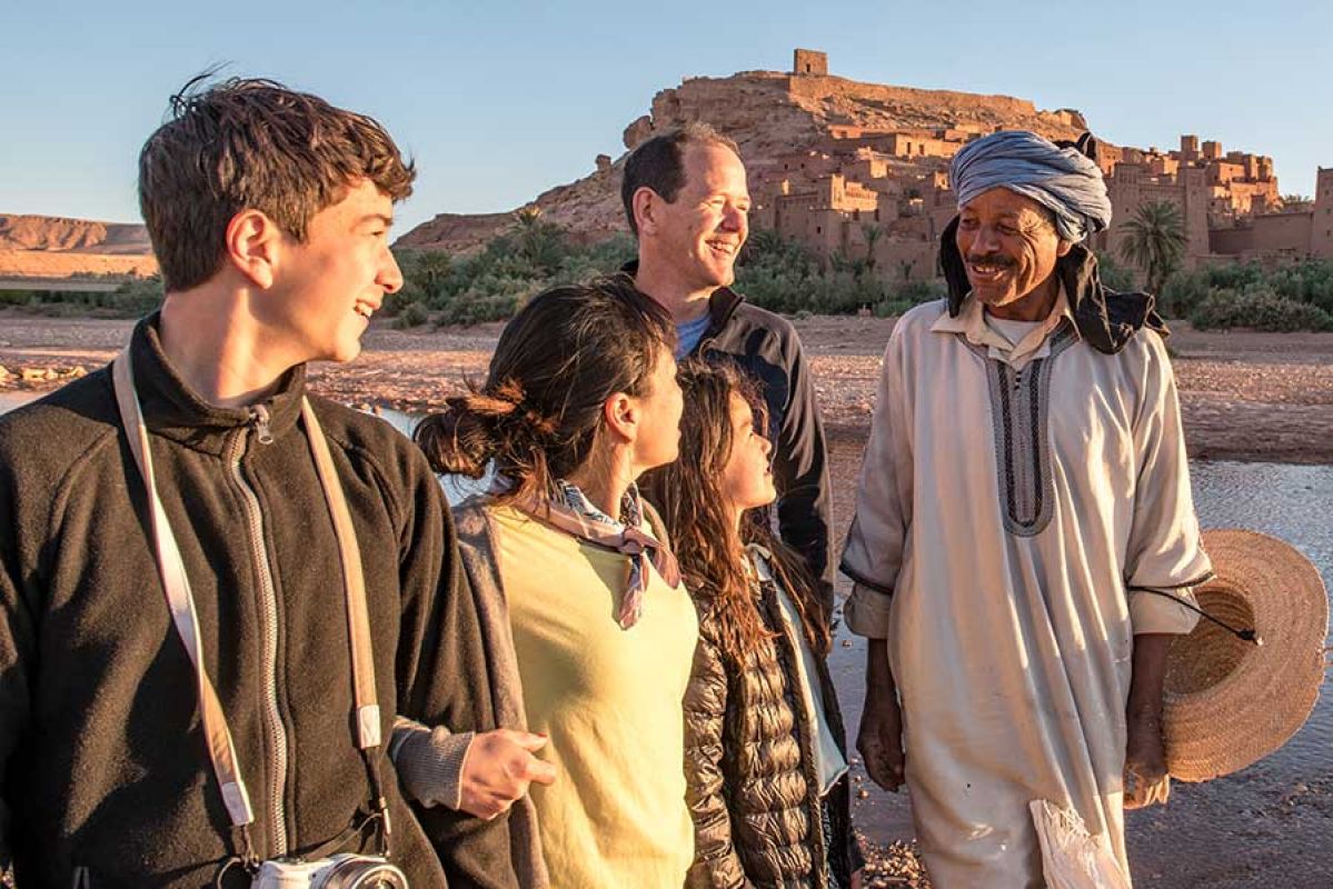 Family listening to guide in Morocco.