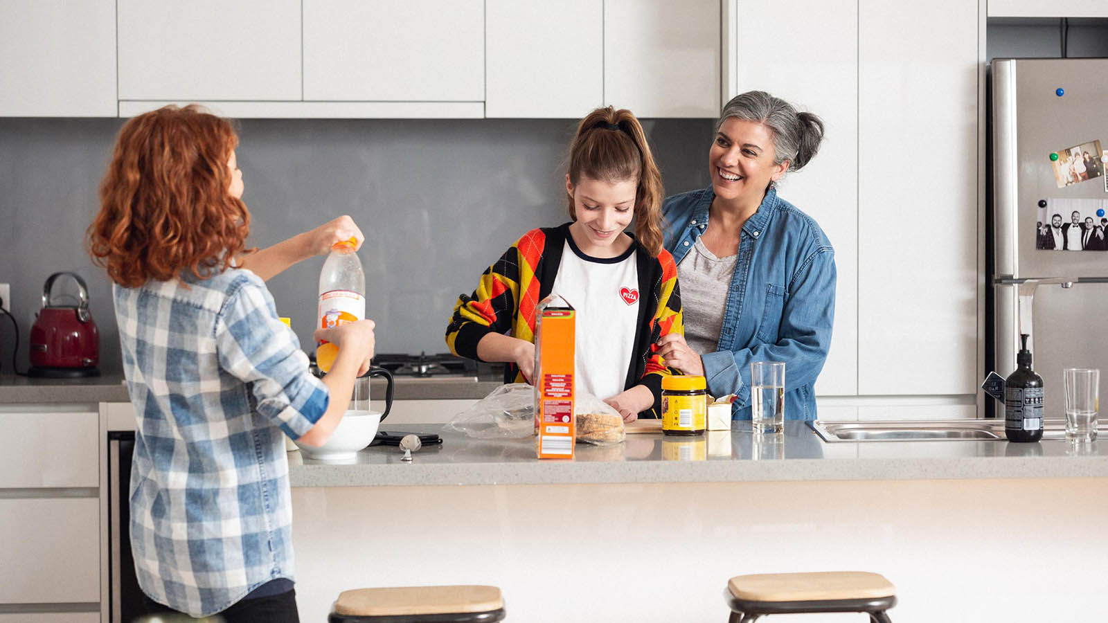 Family making breakfast in the kitchen.
