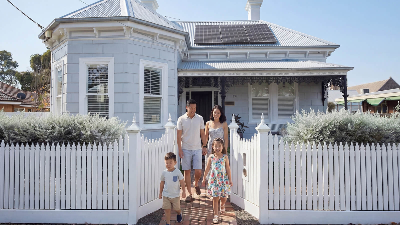 Happy family leaving their home.