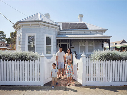 Happy family leaving their home.