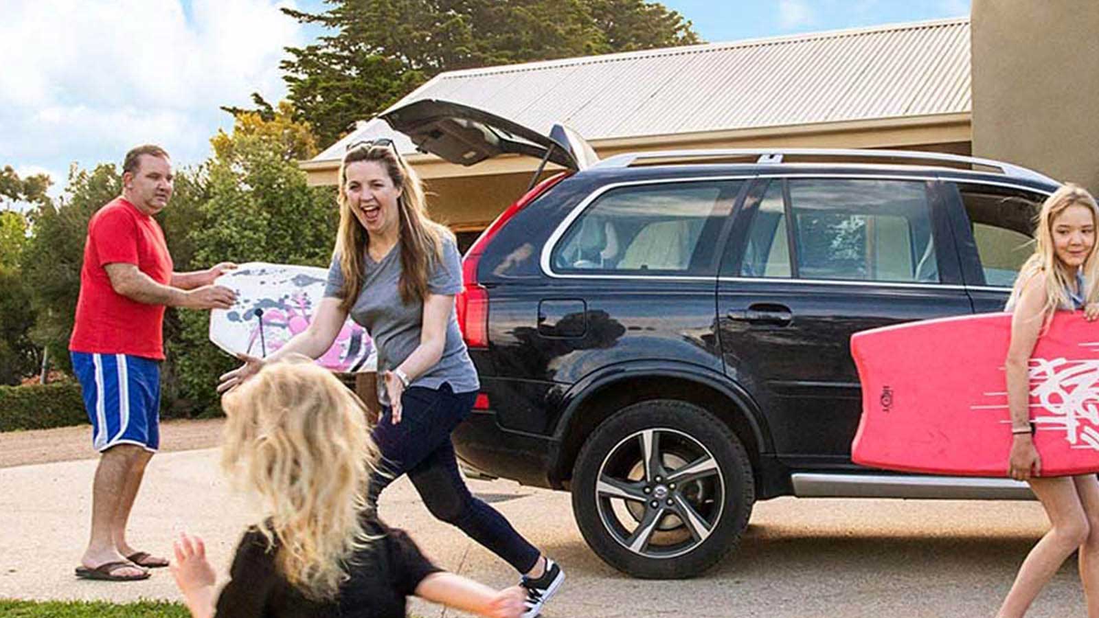 Young family packing the car for a holiday