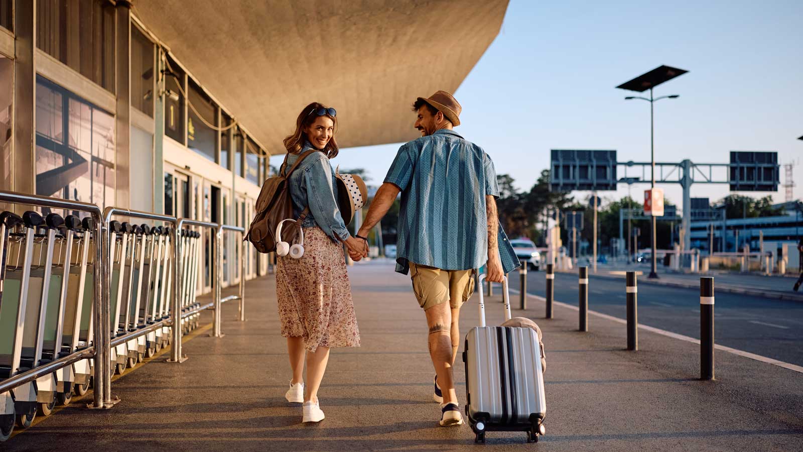 Couple walking outside of the airport