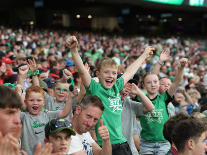 An excited crowd dressed in Melbourne Stars merchandise. 