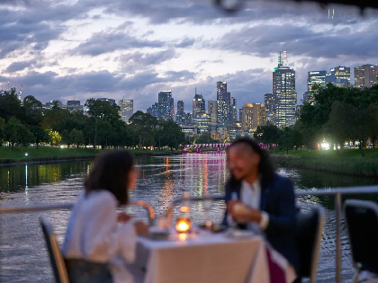A couple enjoying a dinner on a cruise 