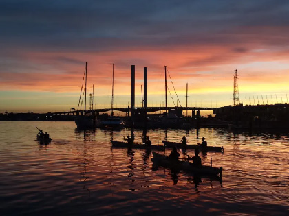 Kayaks on the bay at sunset