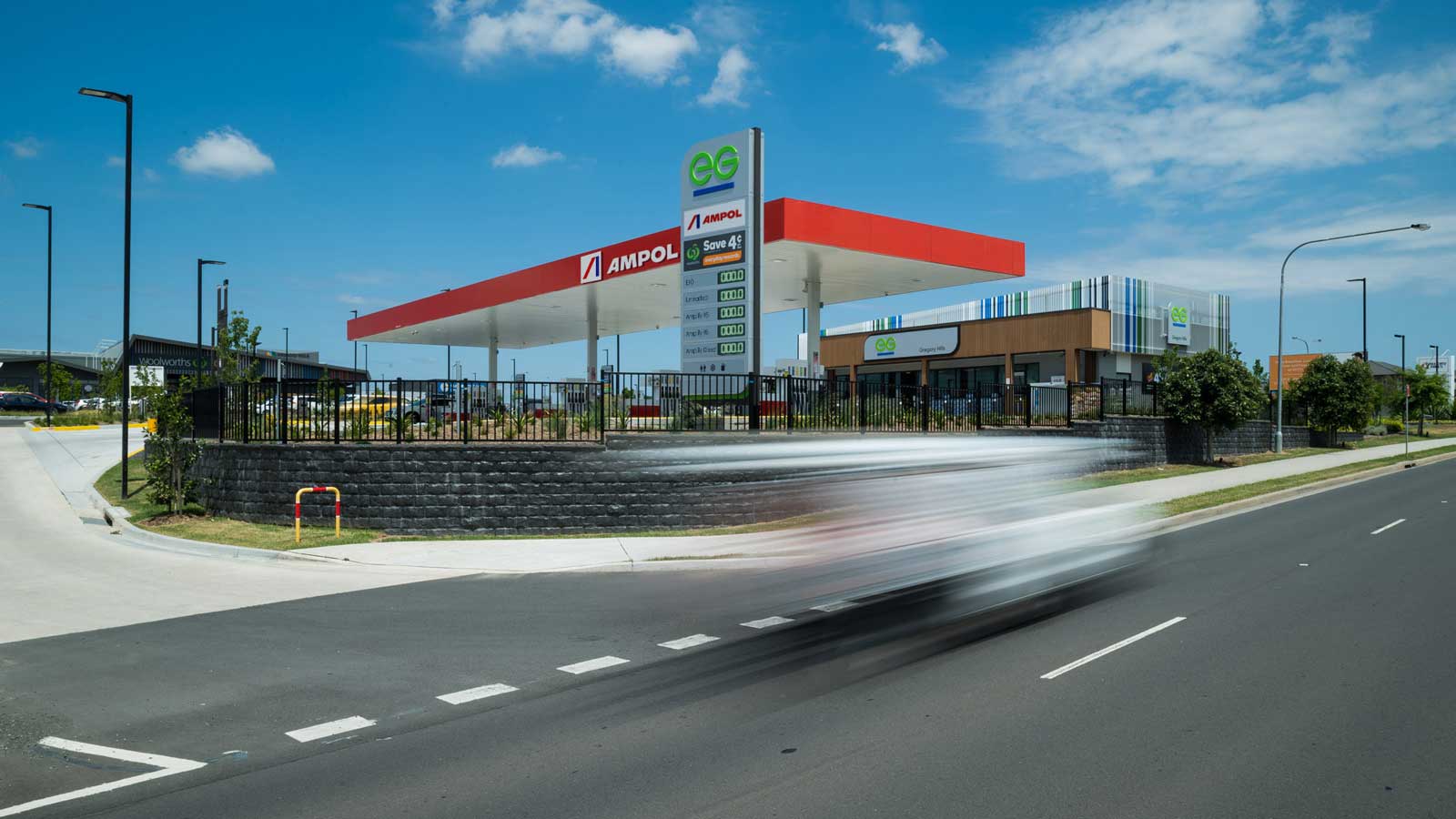 Ampol petrol station during the day.