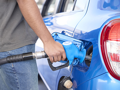 Man filling his car up with petrol.