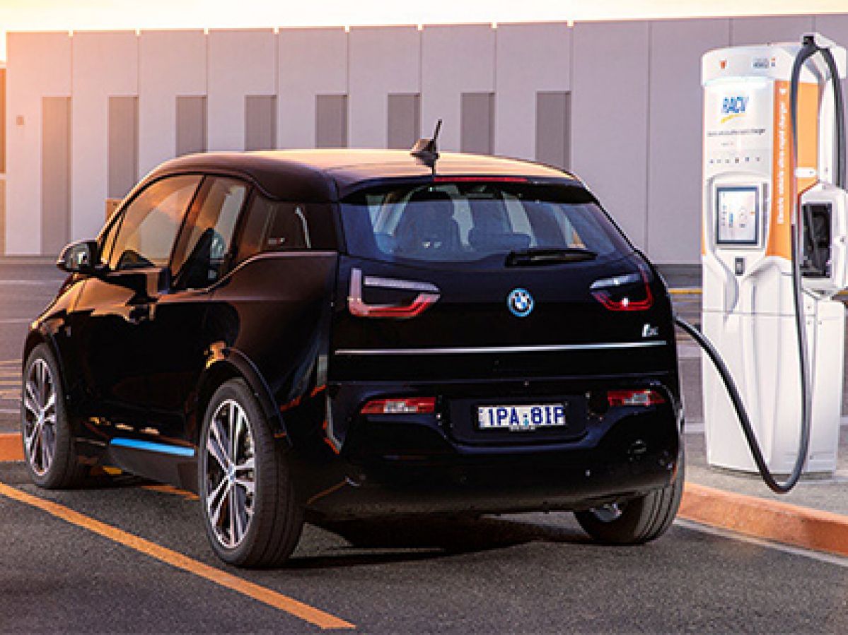 Black electric vehicle charging at an RACV chargefox station.