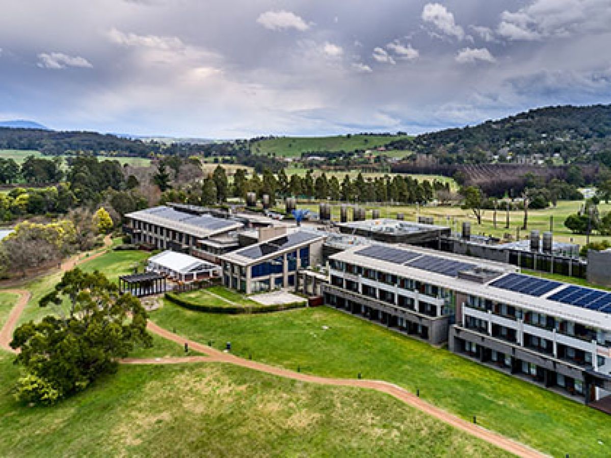 Aerial view of RACV Healesville solar panels and surrounding lush, green grounds.