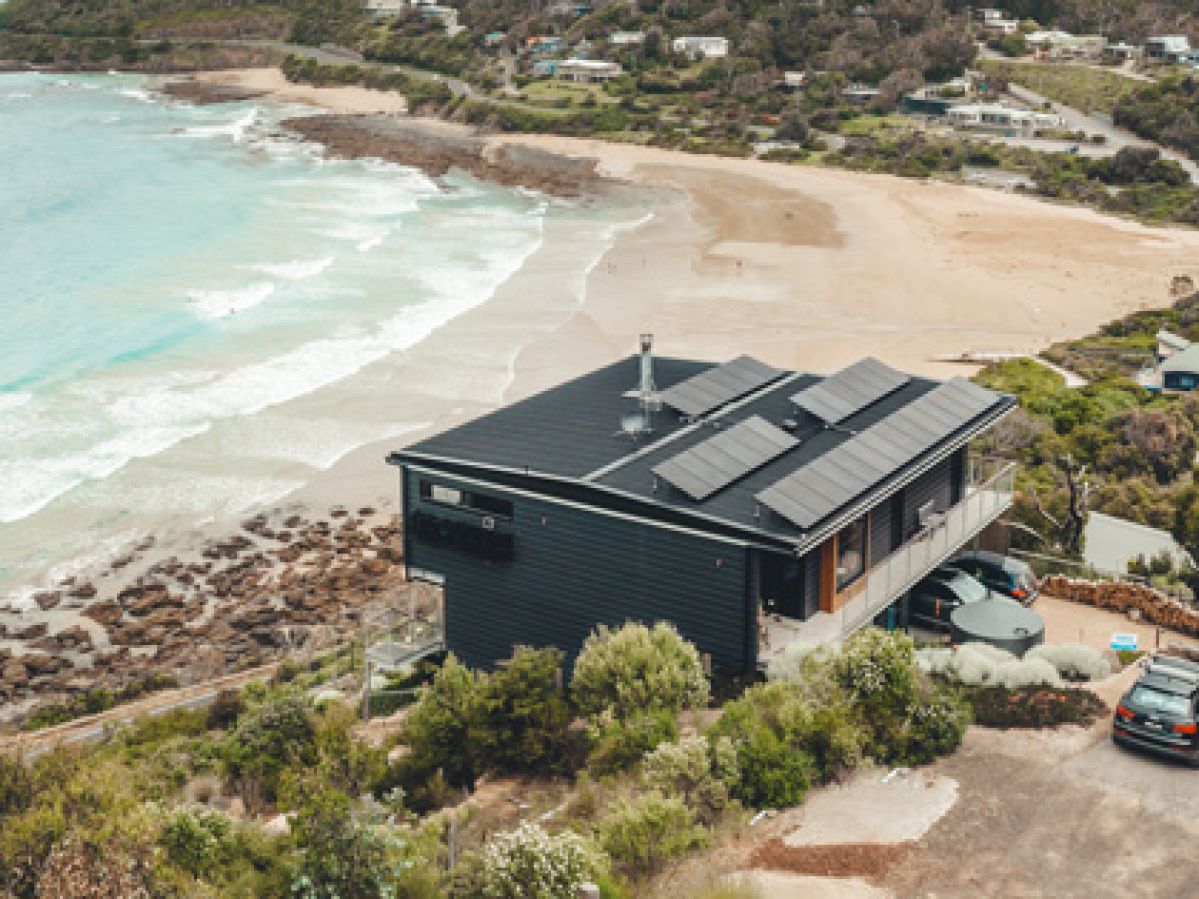 Aerial view of solar panels installed on an ocean-side Wye River home.
