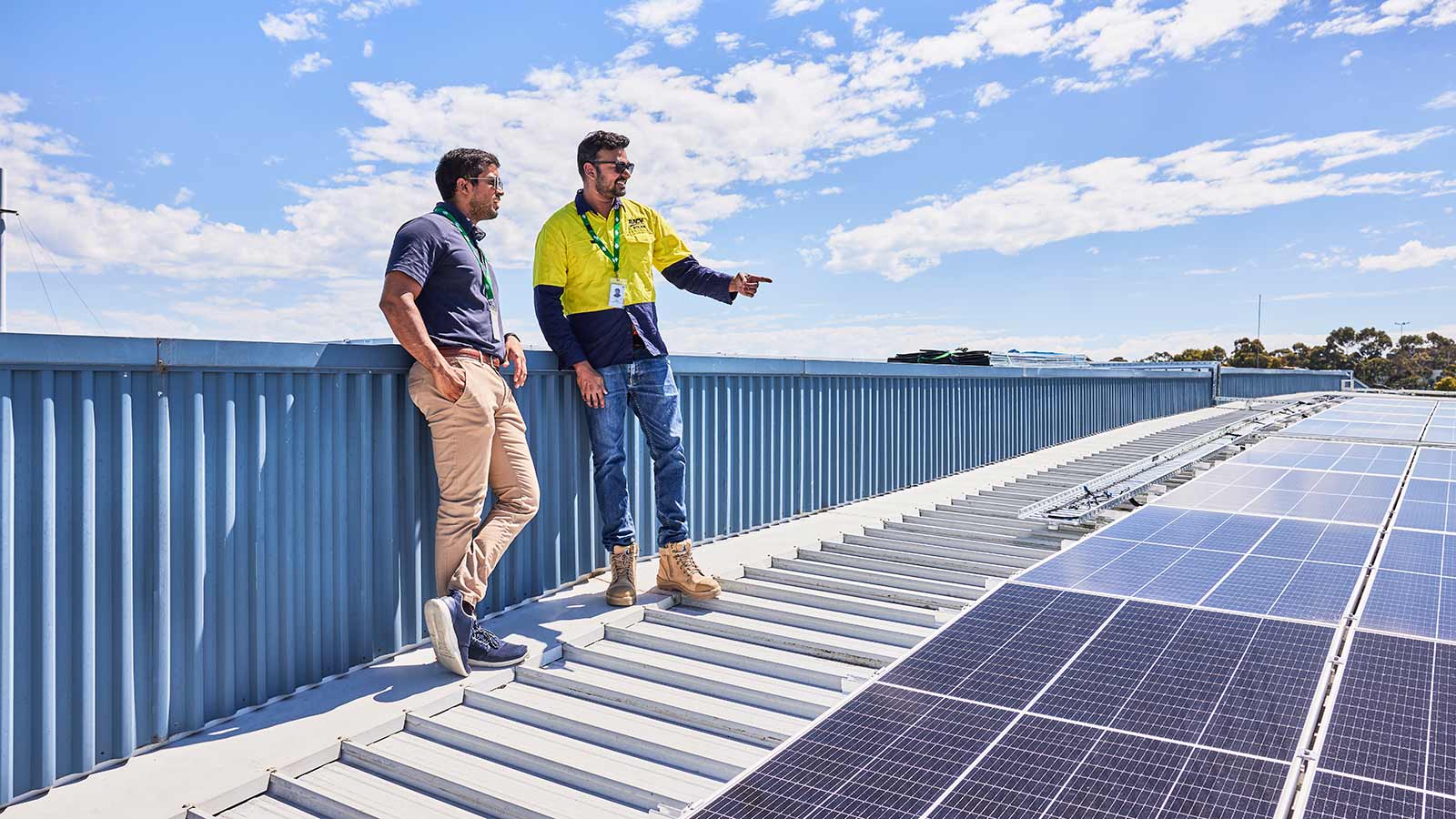 Solar workers standing on a roof