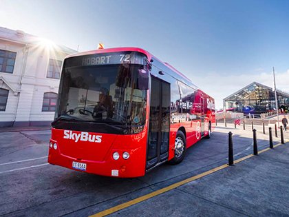 Hobart Airport SkyBus stopped at a street.