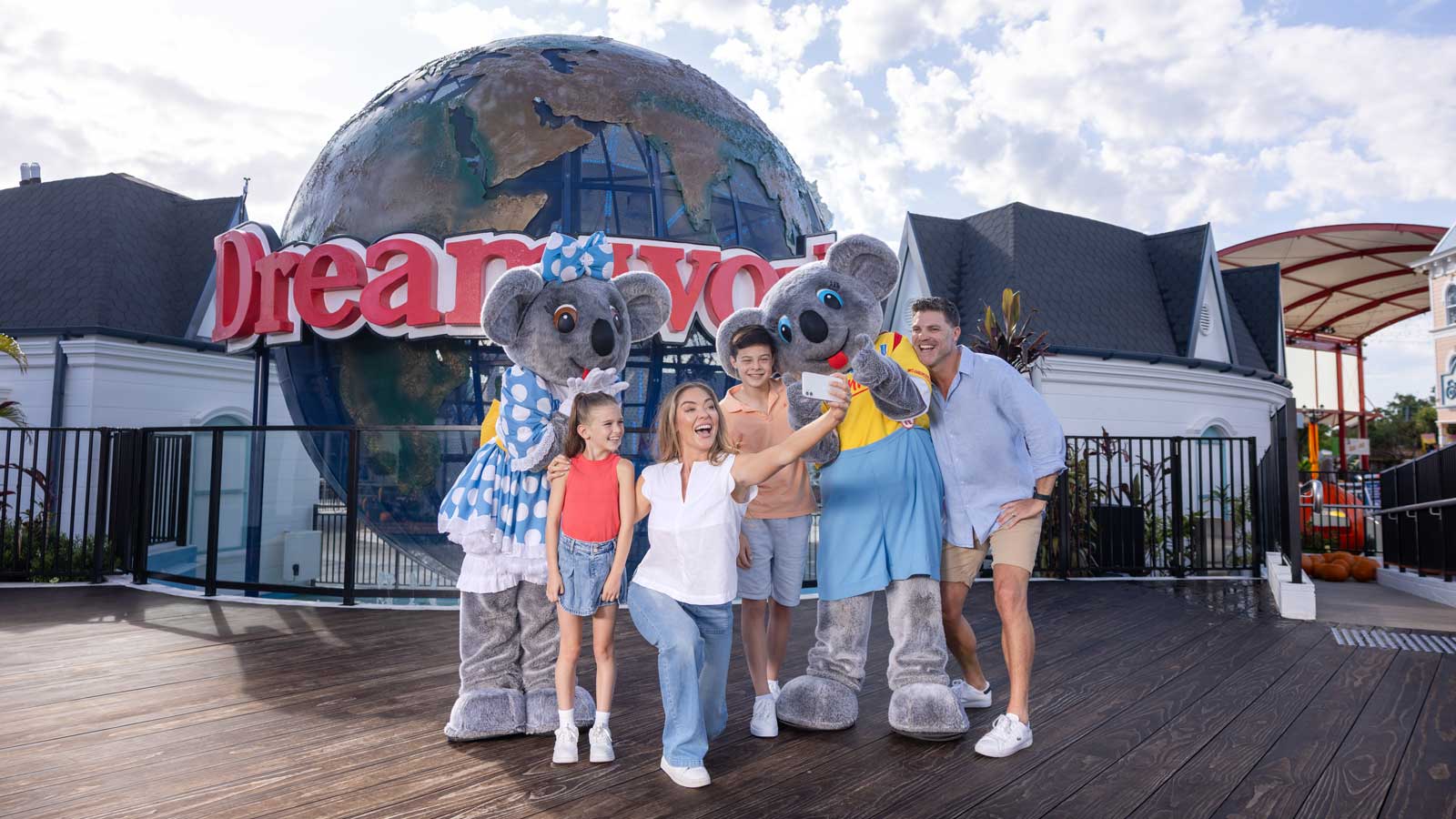 Family taking a selfie at Dreamworld with Koala characters
