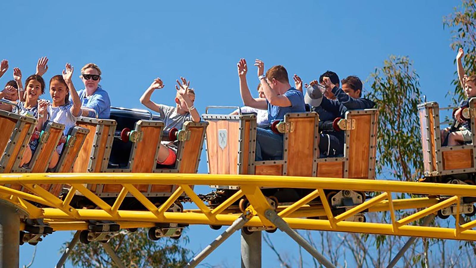 Children riding roller coaster at Gumbaya World.