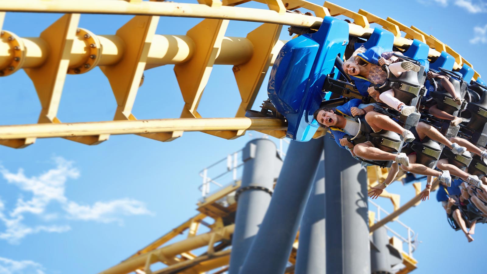 Friends riding amusement park ride
