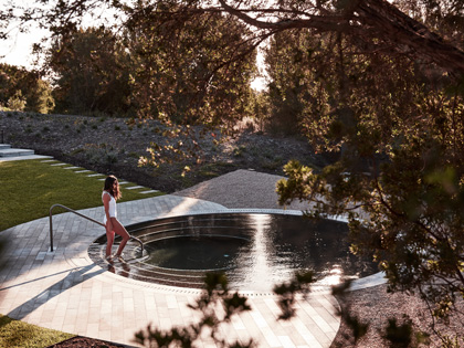 Woman walking into Alba springs.