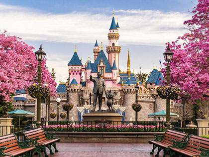 Castle and stature of Walt Disney and Mickey Mouse at Disneyland Paris