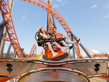 Two people in the midst of a ride.