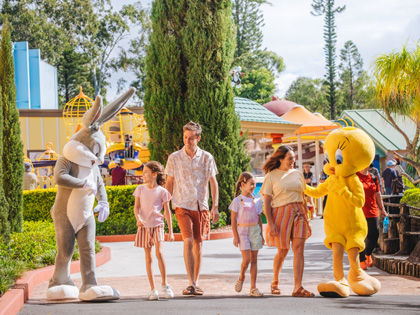 Family with movie characters at a Village Theme park