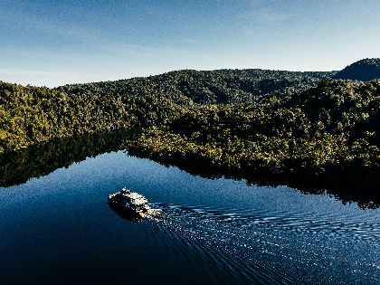 A boat cruising along the Gordon river.