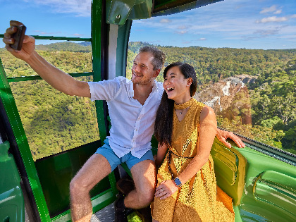 A couple in the cabin of the Karuna Skyrail