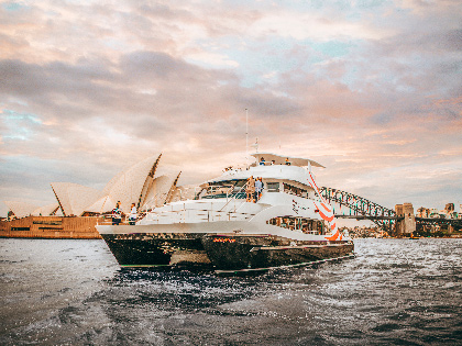 A small cruise boat on the Sydney Harbour