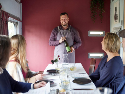 Guests enjoying a meal on the Q Traim