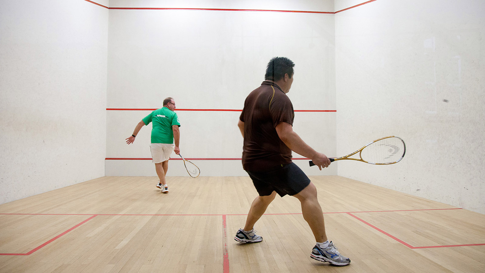 Two men playing squash at RACV City Club.