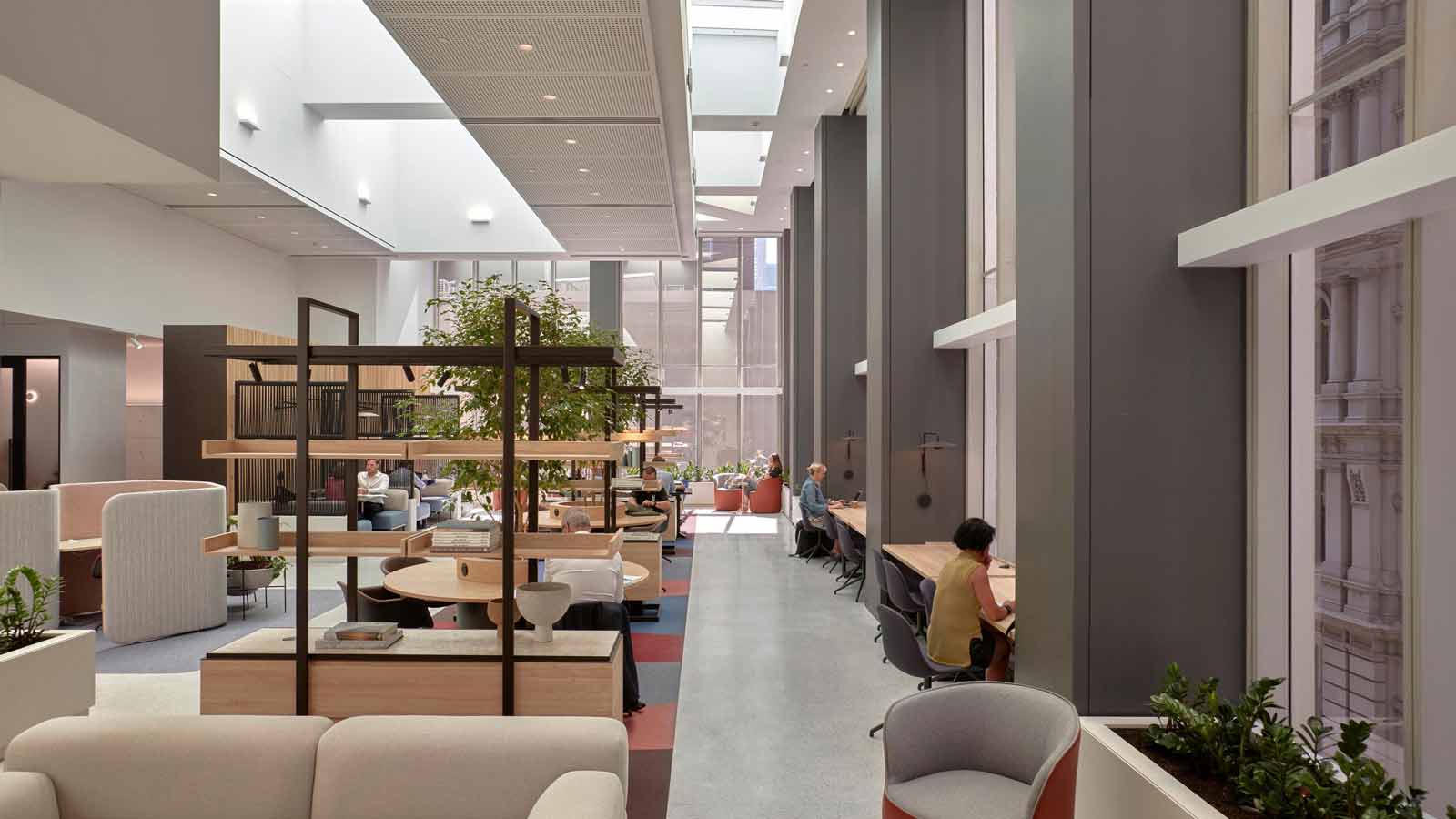 People working in the modern shared working space at RACV City Club.