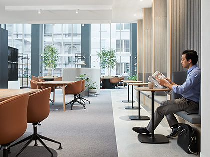 Person sitting at a desk and reading in the RACV City Club business centre.