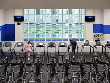 Club members working out on treadmills in the city club fitness centre.
