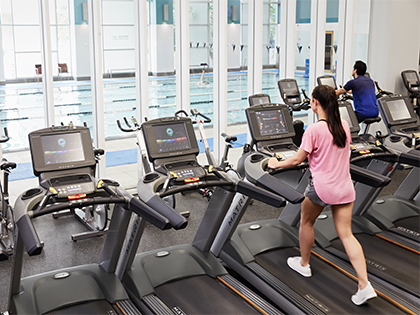 Members using treadmills at the city club gym.