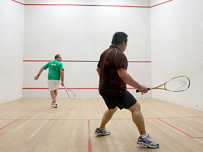 Two men playing squash at RACV City Club.