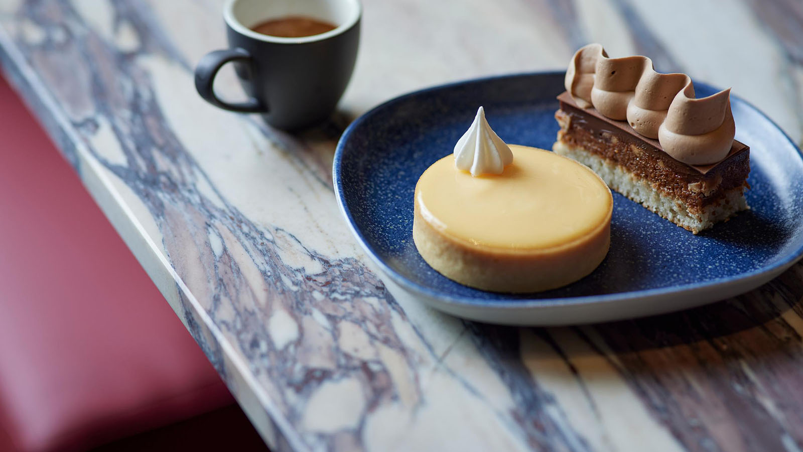 A dessert of a lemon tart and hazelnut millefeuille, served at RACV City Club's bistro.