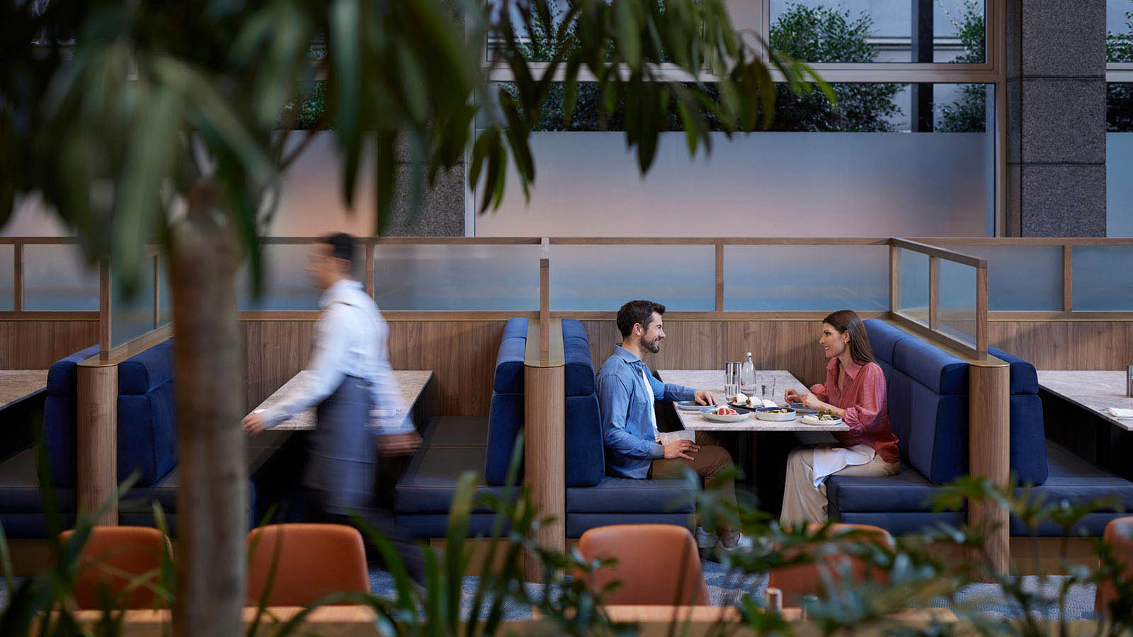 A couple enjoying a meal at RACV City Club's bistro.