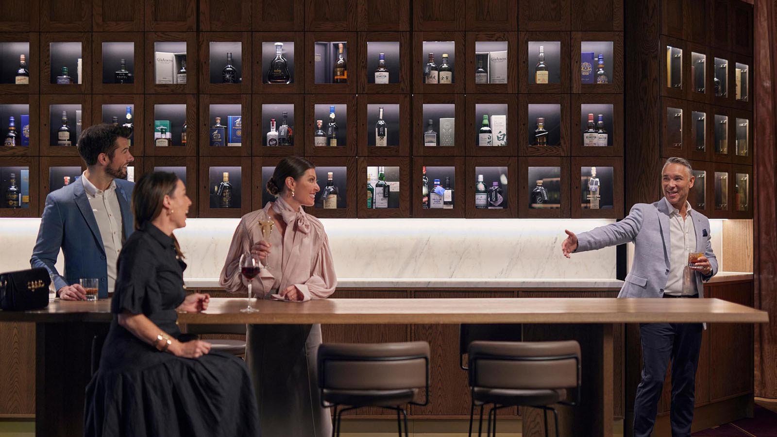 A group of four enjoying drinks  at RACV City Club's Wine Bar.
