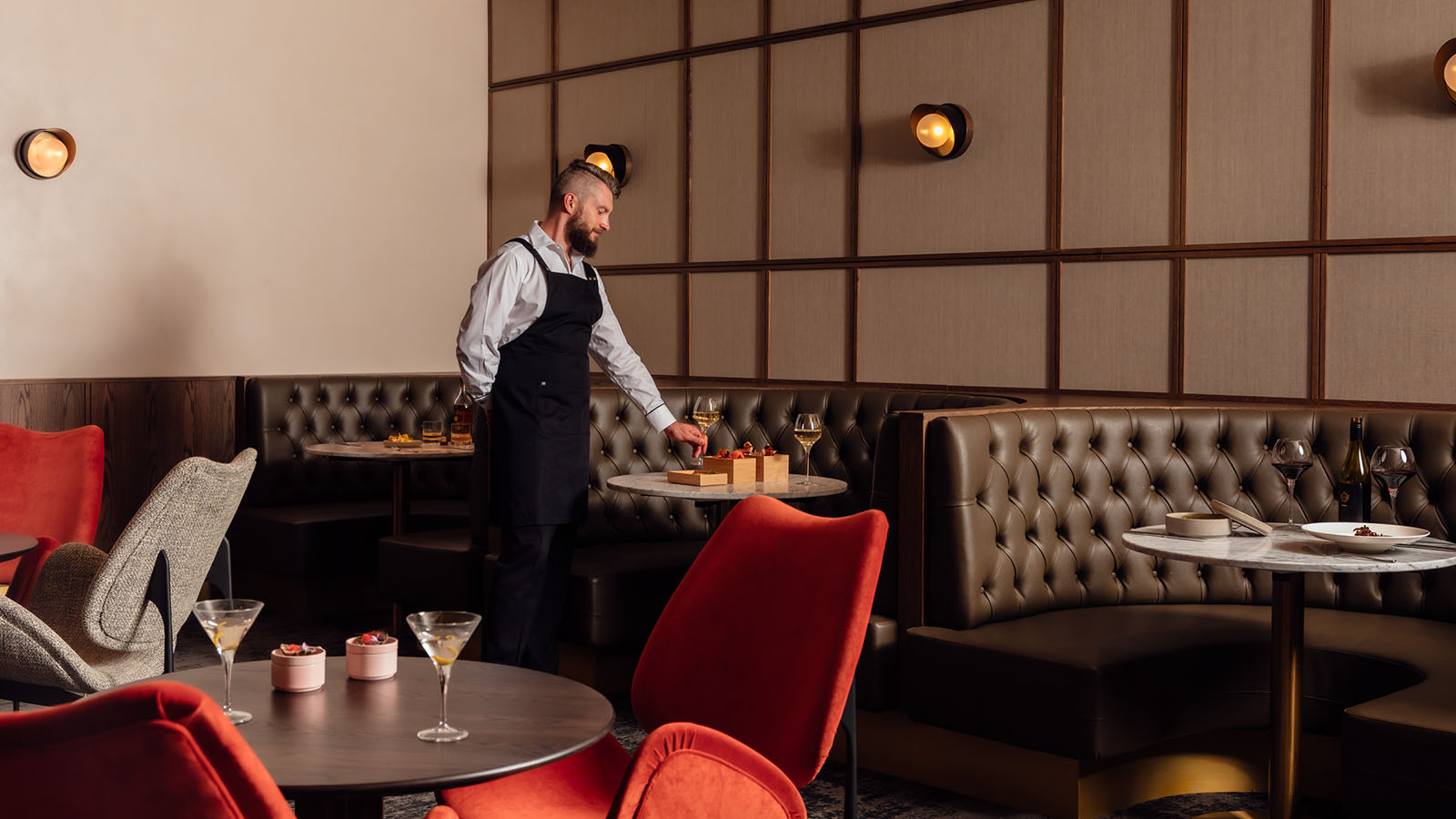 A waiter setting a table at the RACV City Club Wine Bar.