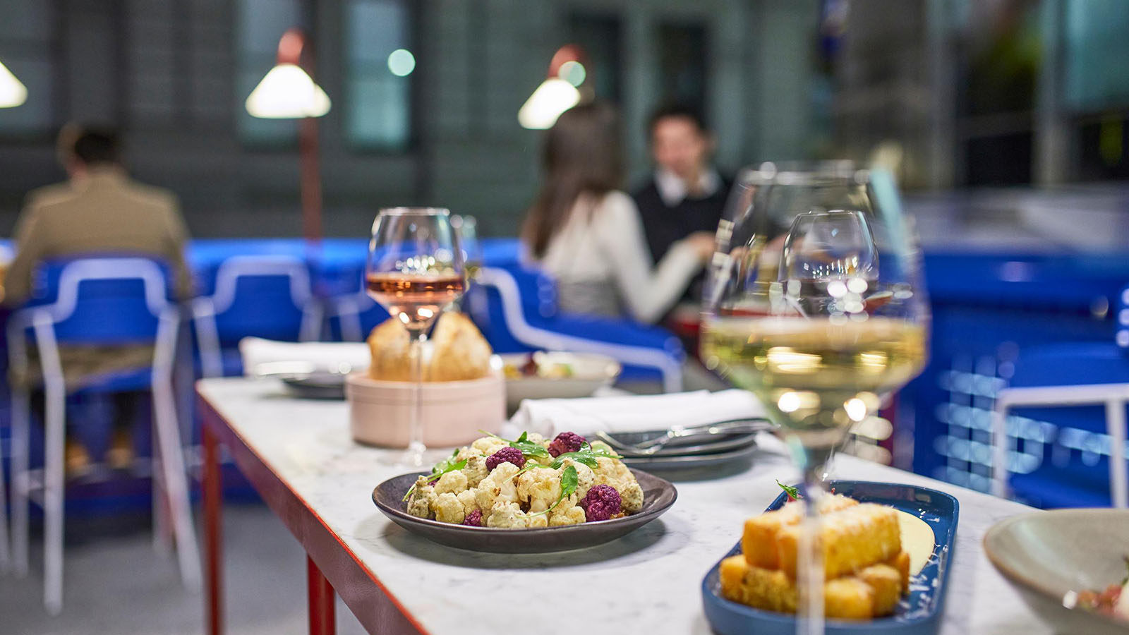 A table at Sojourn arranged with wine and finger food.