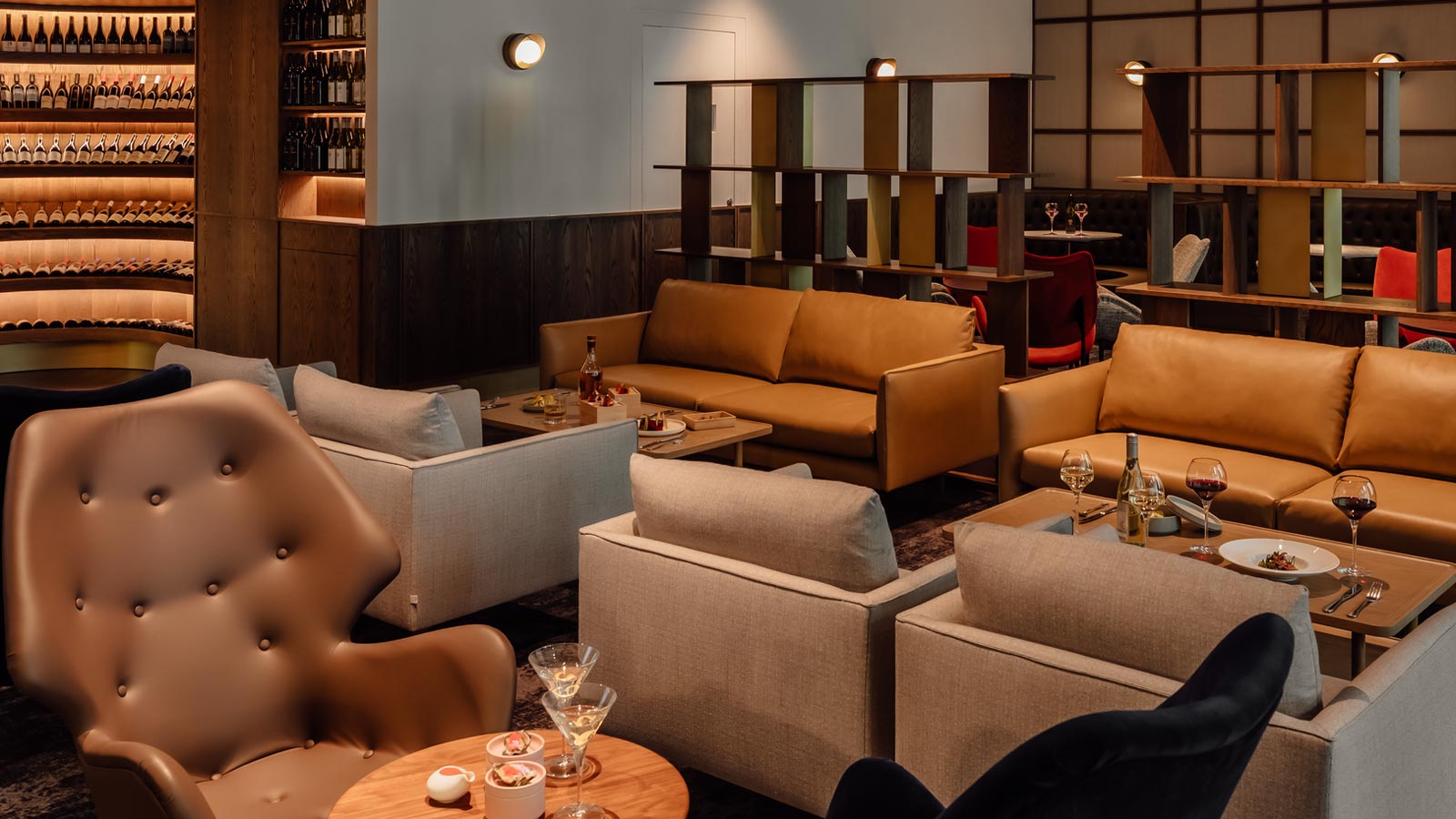 Numerous seating areas in the Wine Bar with drinks and nibbles.