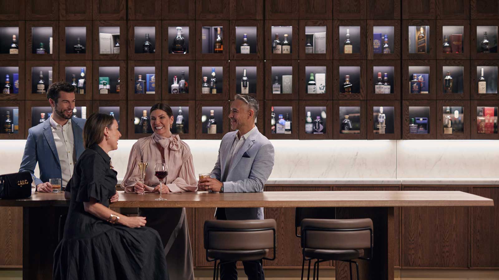 A group of four enjoying drinks at RACV City Club's Wine Bar.
