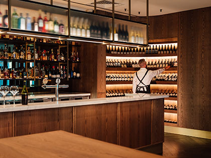 A somellier making a selection from the cellar at RACV City Club's Wine Bar.