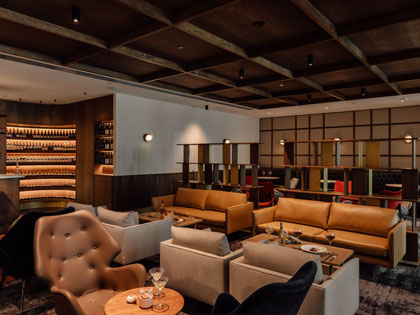 Numerous seating areas in the Wine Bar with drinks and nibbles.