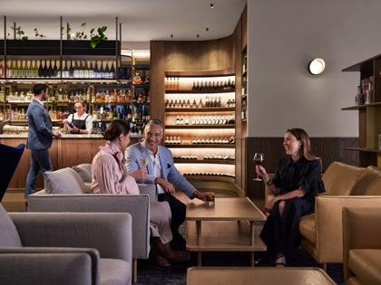 A group of friends enjoying a glass of wine in the Wine Bar at RACV City Club. 