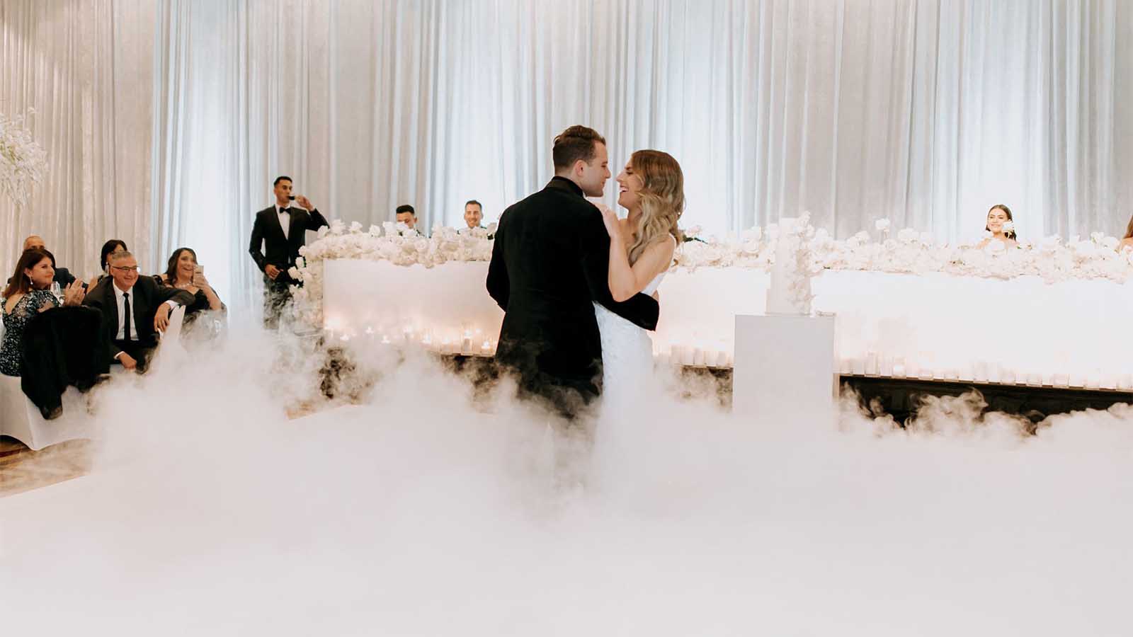 Couple having their first dance in the Grand Ballroom at the City Club.